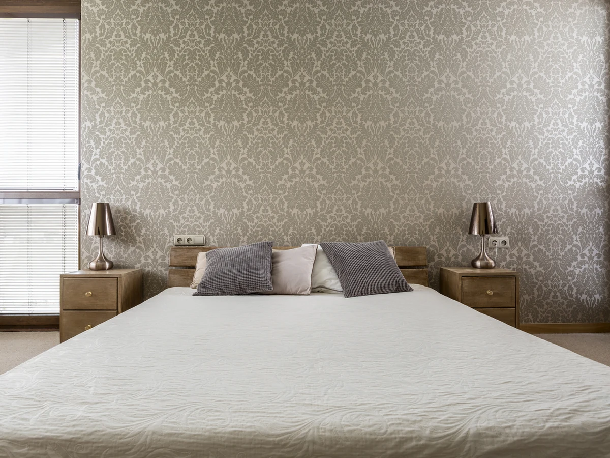 Kingsize bedroom with gold walls and professional paint finish