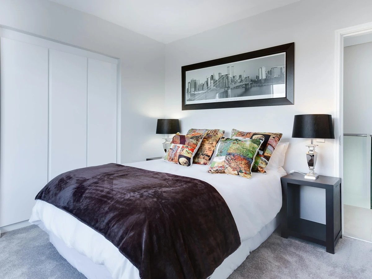 Modern bedroom with white walls and natural light in Ipswich