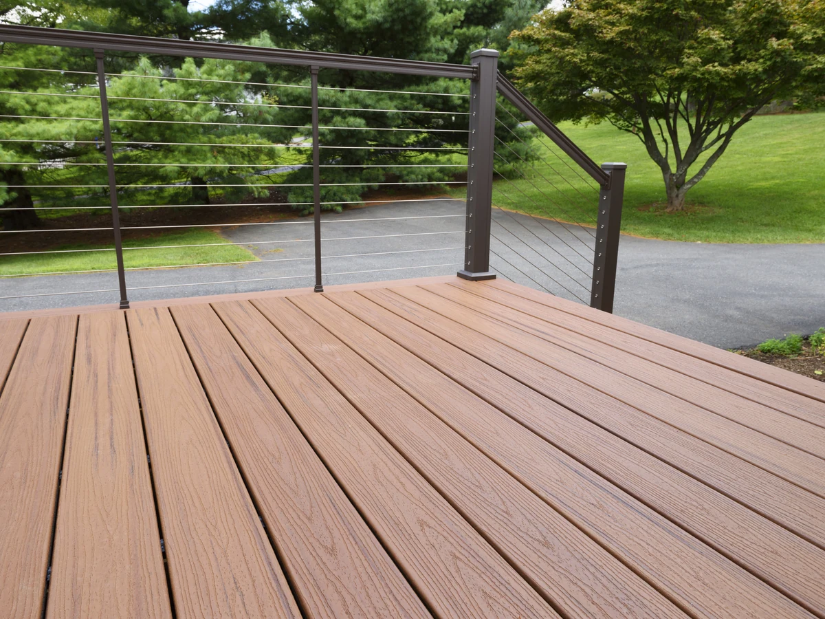 Composite wood decking in garden setting, natural finish without painting