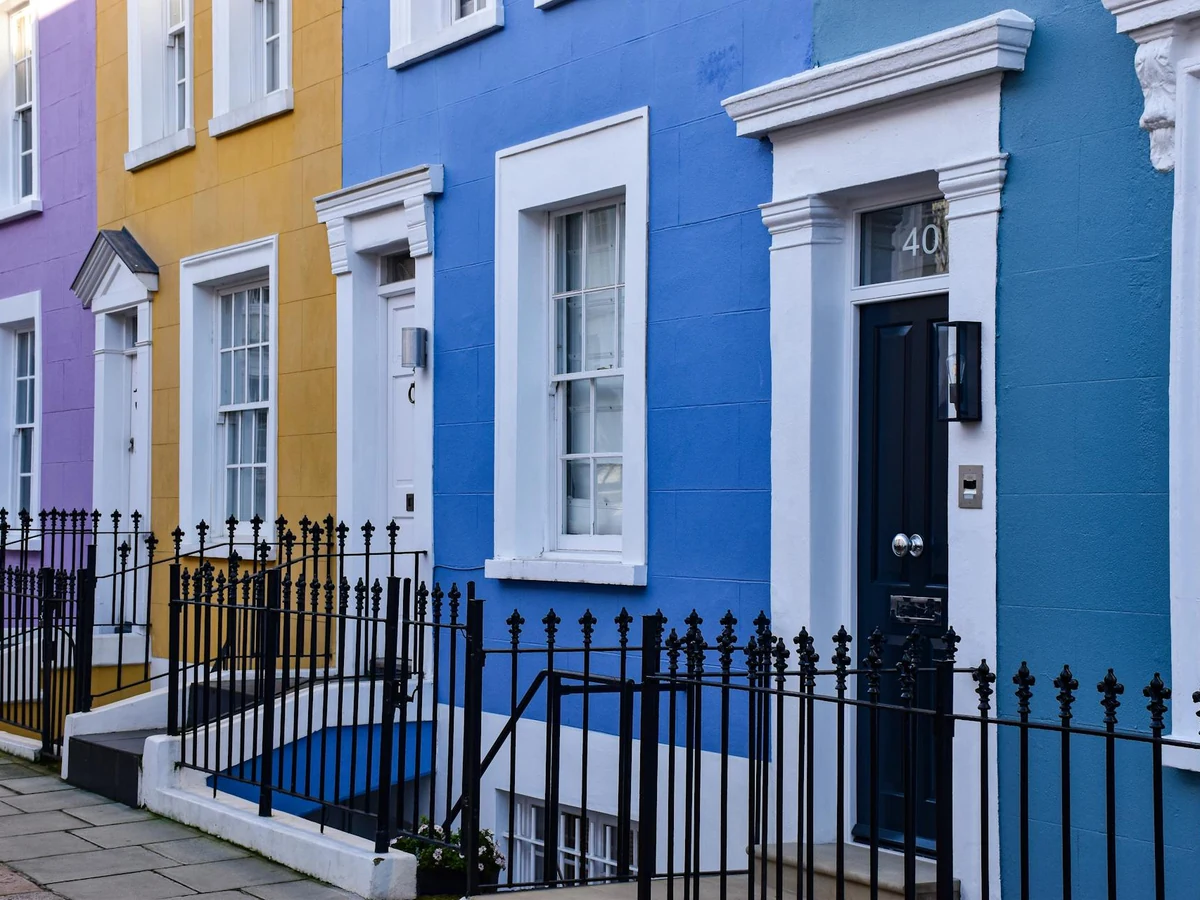 Row of colourful terraced houses showing exterior painting transformation in Ipswich