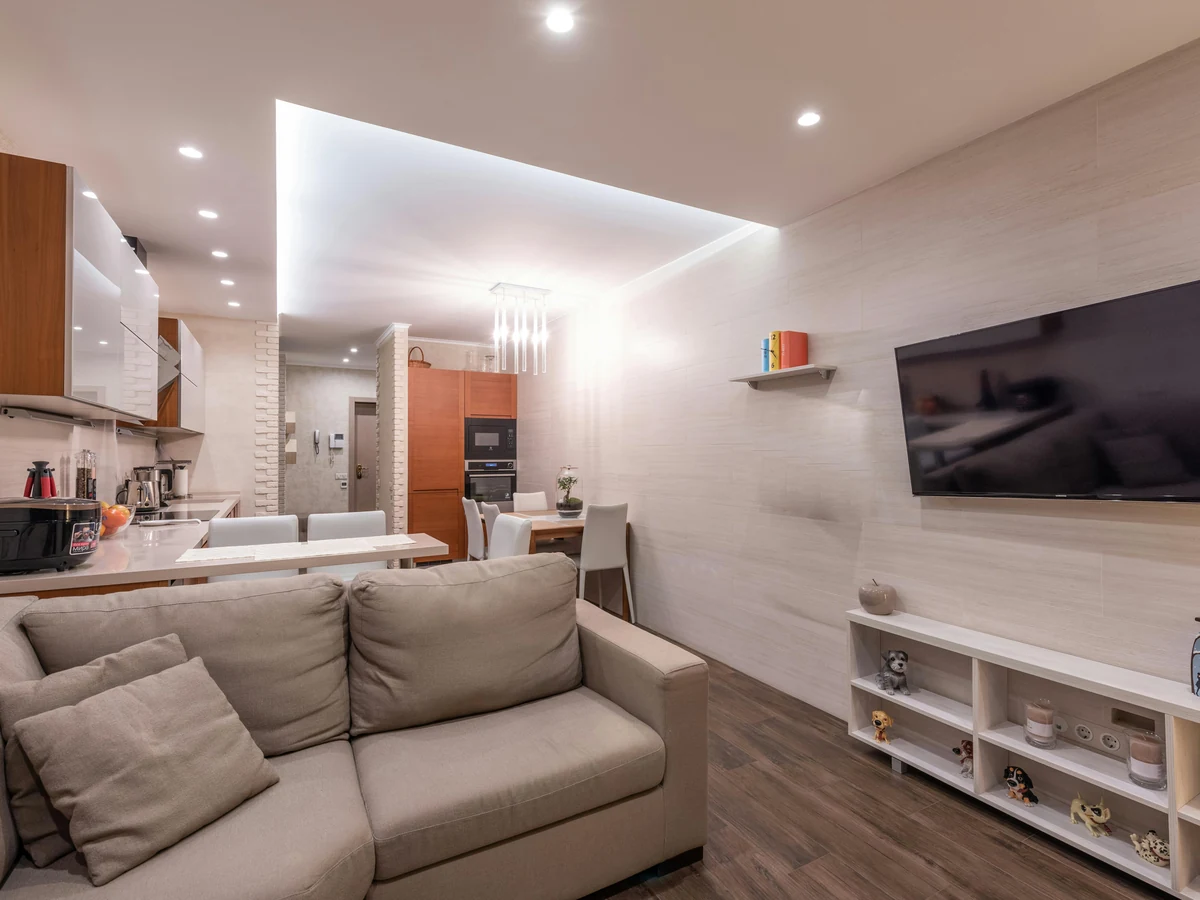 Compact open-plan living space painted in soft grey by Ipswich Painters