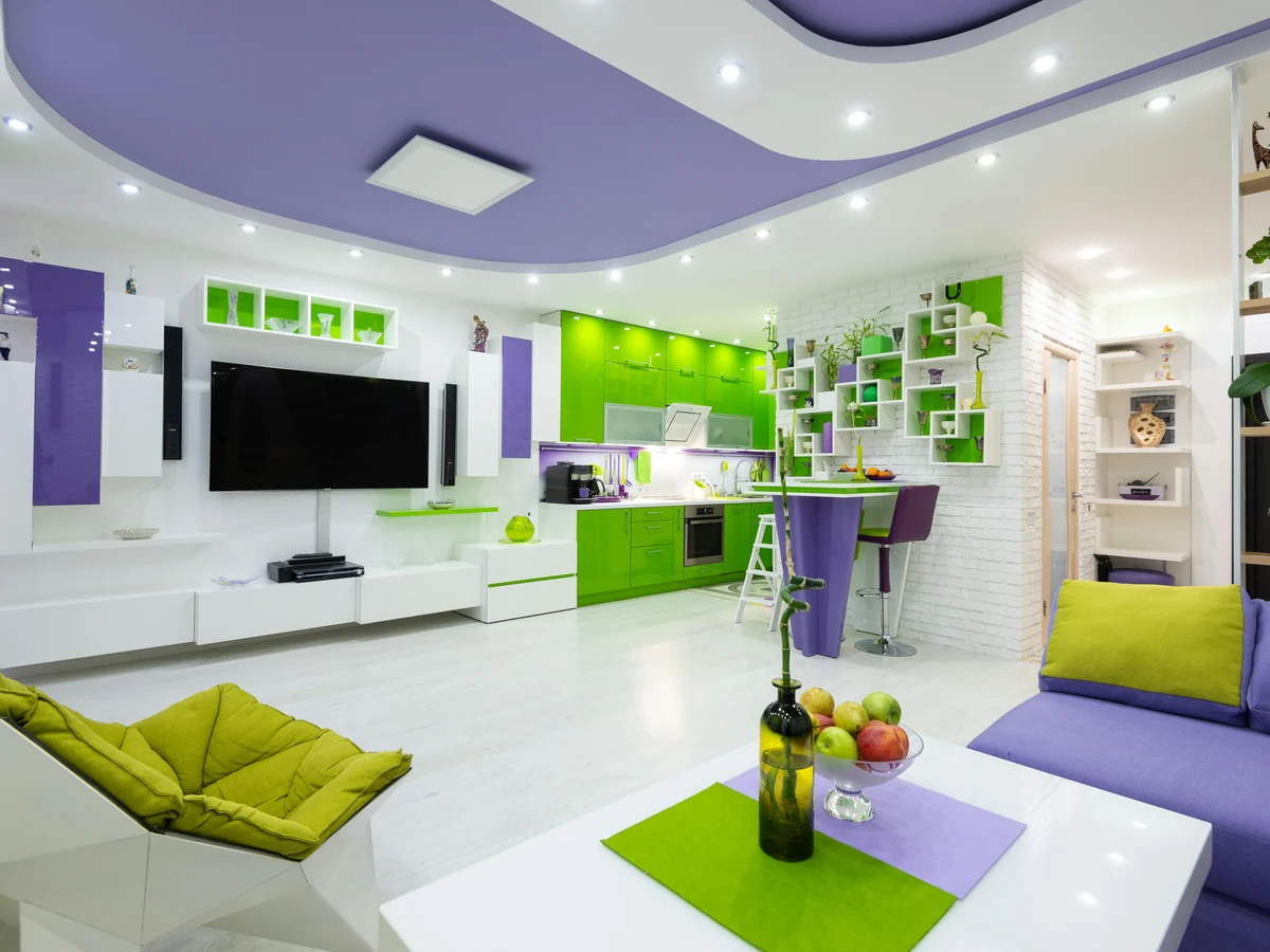 Vibrant green and purple feature wall in living room painted by Ipswich Painters